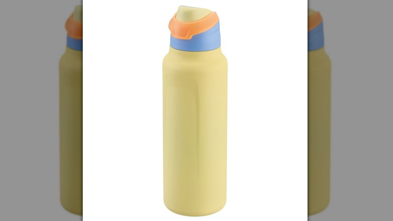 Yellow water bottle from Aldi against white background.