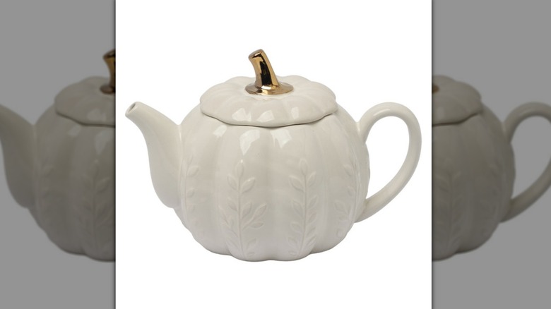 White pumpkin teapot from Aldi against white background.