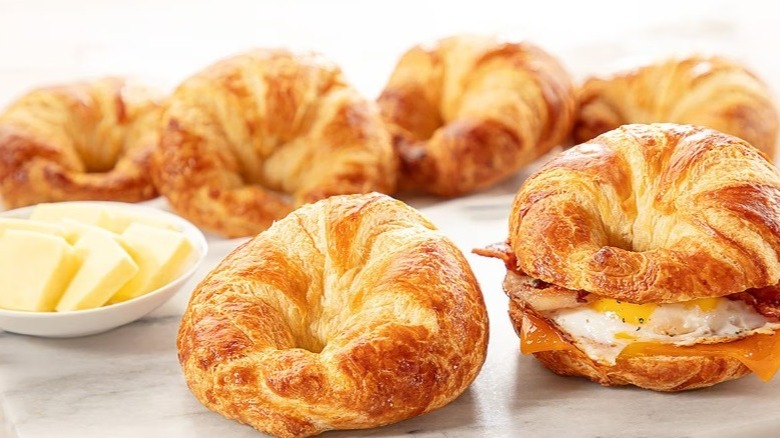 Member's Mark all-butter sandwich croissants with a small dish of butter slices and one egg sandwich