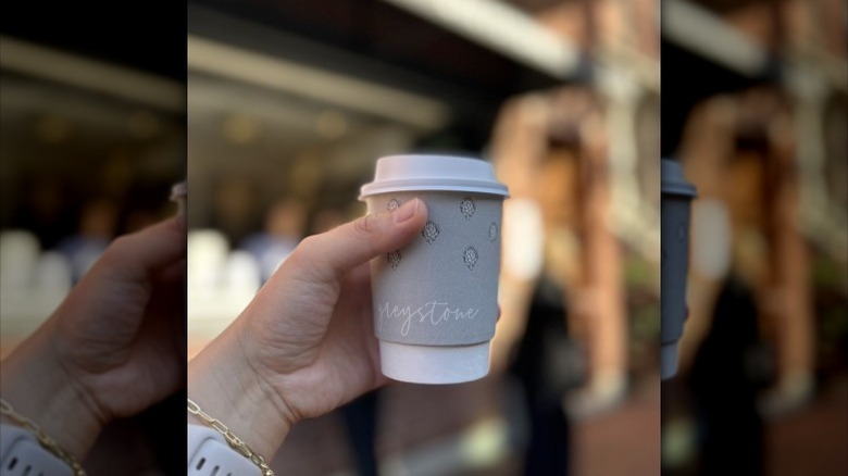 Greystone hot latte in front of the walk-up window