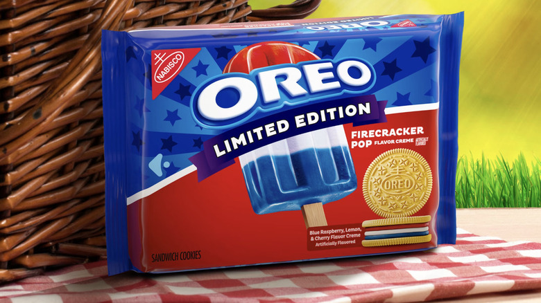 Package of Firecracker Pop Oreo cookies on a gingham blanket with picnic basket