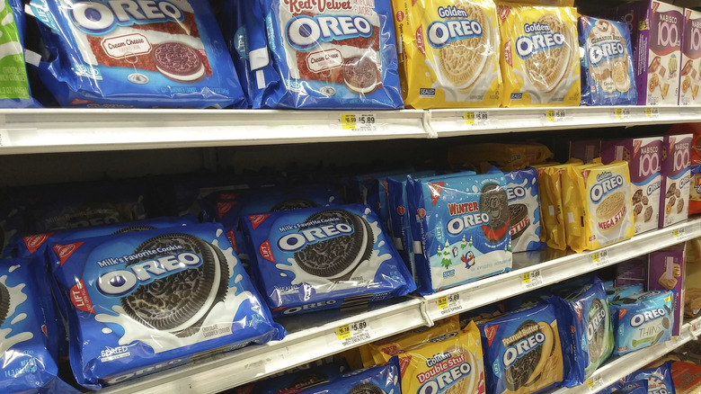 Packages of different Oreo flavors on a supermarket shelf