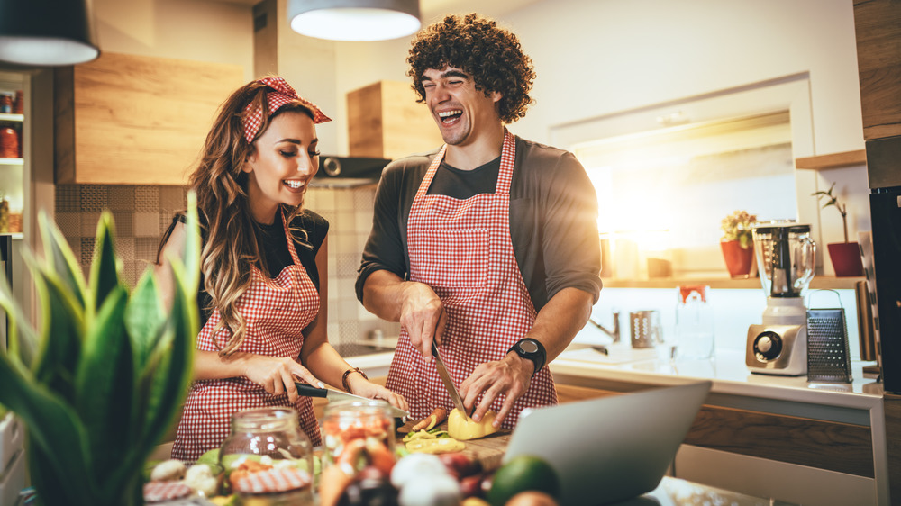 people cooking laughing