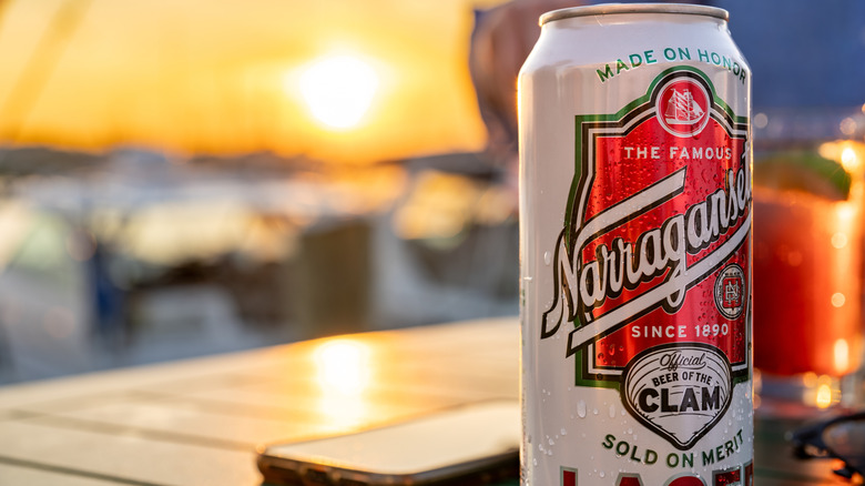 A can of Narragansett lager outdoors at sunset