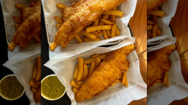 Large piece of cod on top of french fries