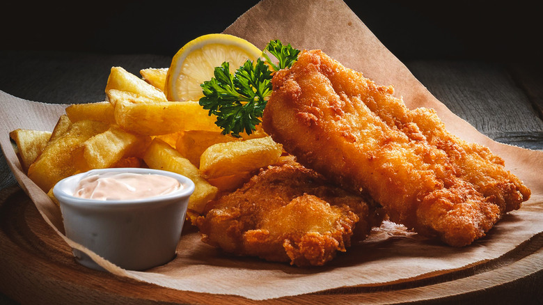 Fish and chips platter with lemon and tartar sauce on the side