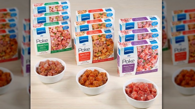 Boxes of three kinds of Annasea poke lined up behind a bowl of each