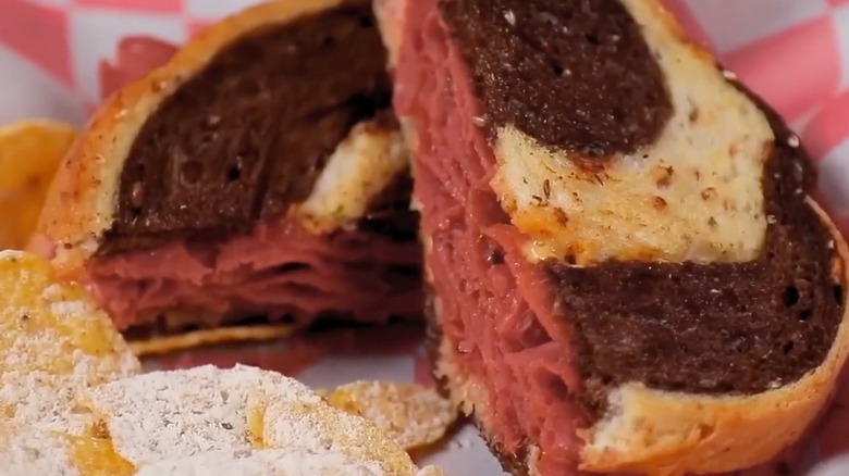 close up of reuben sandwich with potato chips in basket at 10th street diner in Indianapolis