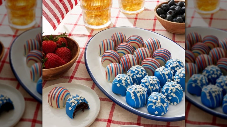 Picnic table with Member's Mark Patriotic Cake Balls, fruit, and drinks