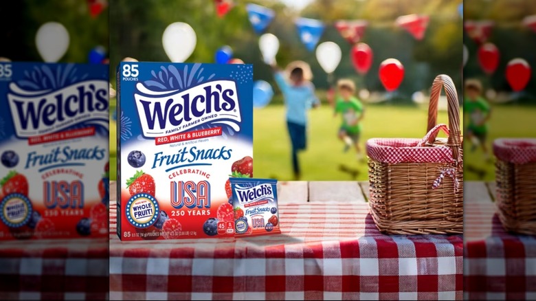 Patriotic picnic table setup with a box of Welch's fruit snacks