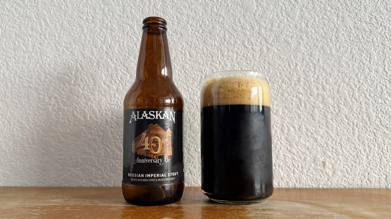 Alaskan 40th Anniversary Ale bottle beside a full glass