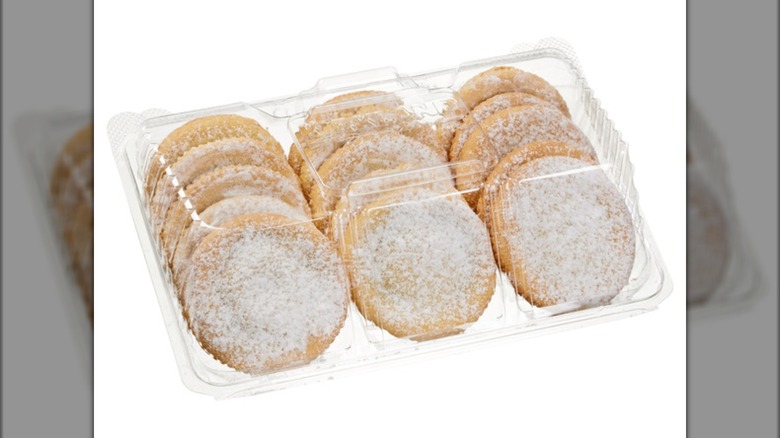 Plastic container with 15 powdered sugar-dusted raspberry filled cookies.