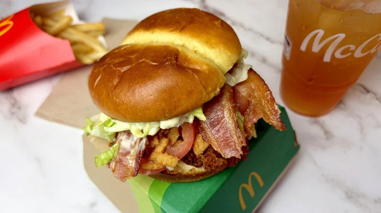 Bacon Caesar McCrispy sitting on McDonald's box with fries in the background