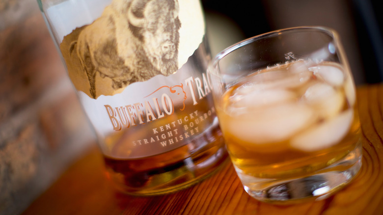 glass and bottle of Buffalo Trace