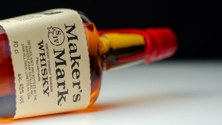 Maker's Mark whiskey bottle lying sideways