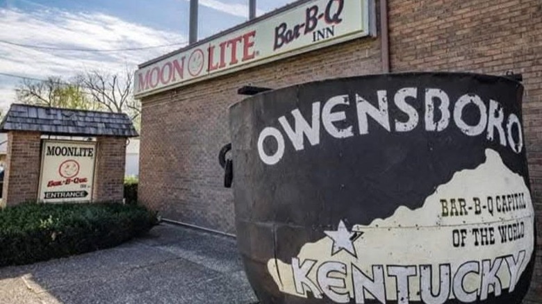 The store front of Moonlite Bar-B-Q Inn with the smoker