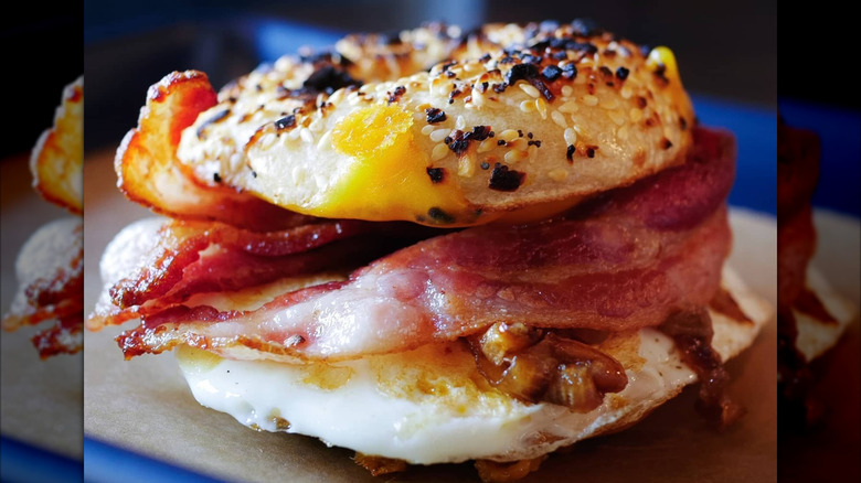 Bacon, egg, cheddar, and caramelized onions on a bagel