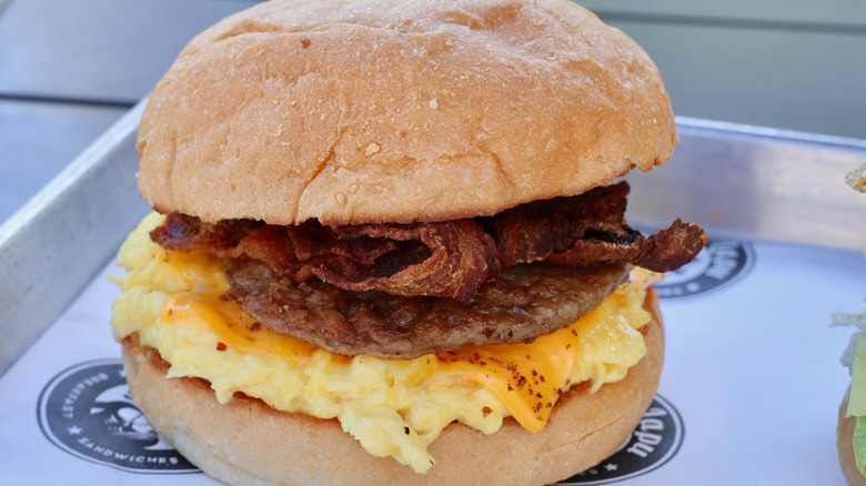 bacon, sausage cheese & eggs sandwich