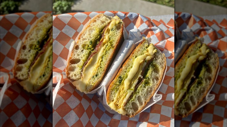 Breakfast sandwich cut in half on a table