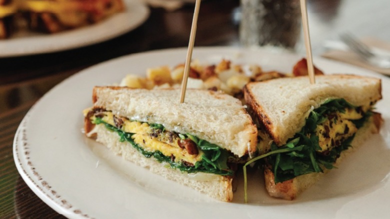 Sandwich split in half on a plate