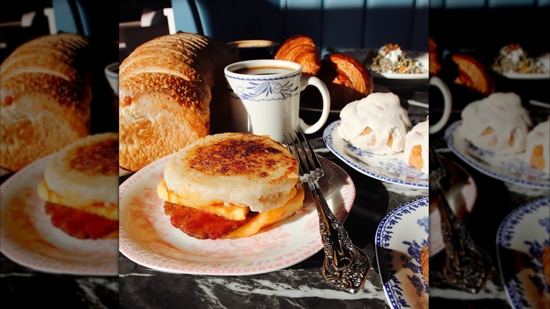 Breakfast sandwich on a table with other breakfast items
