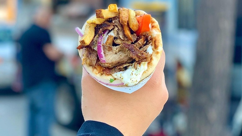 hand holding gyro