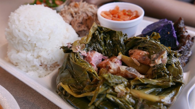 a close up of lau lau white rice taro root and kalua pig a typical hawaiian plate lunch