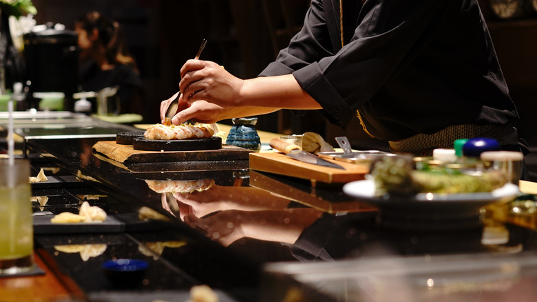 chef preparing sushi