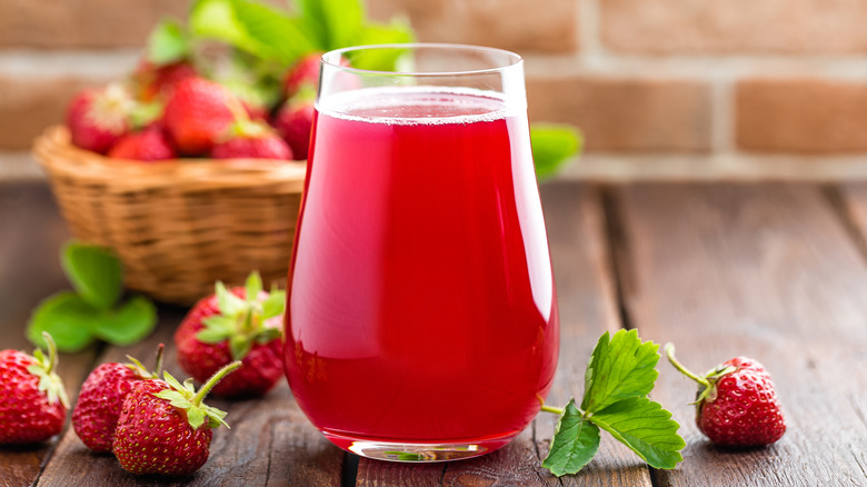 strawberry drink surrounded by strawberry