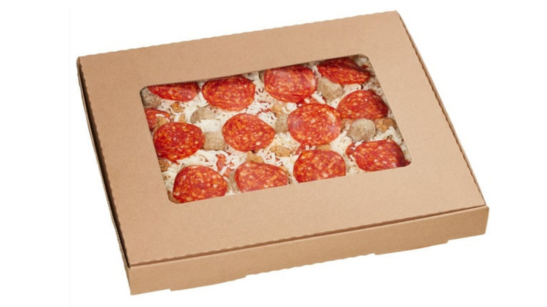 Costco's four-meat pizza in cardboard box