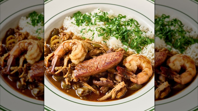 seafood stew plated with white rice