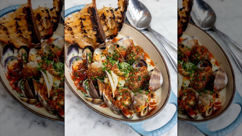 Hama Hama clams, celery root cream, 'nduja, soft herbs, and grilled bread
