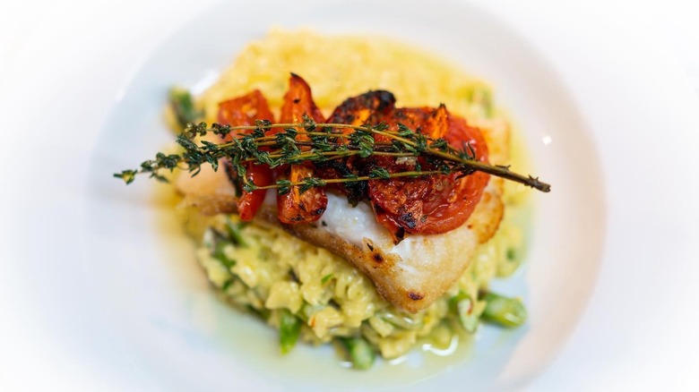 Asparagus risotto with roasted tomato and grilled fish at Cowfish