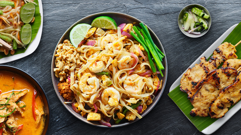 An assortment of Thai food with a black background