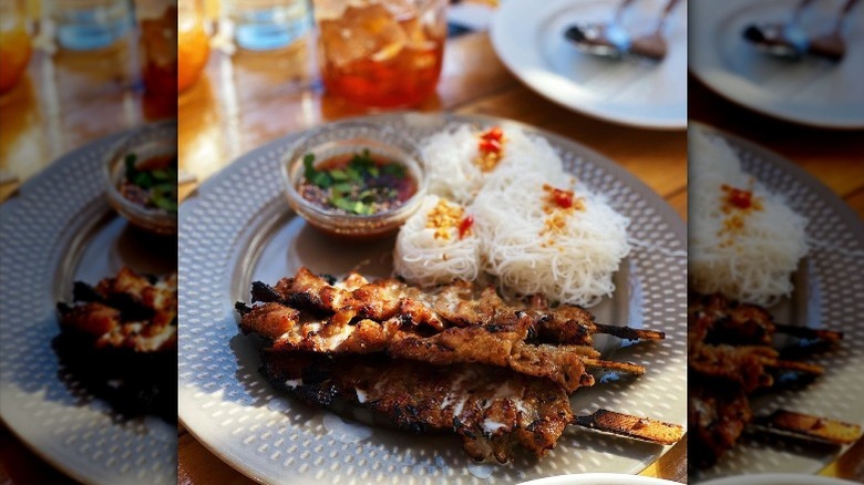 Chicken skewers and noodles