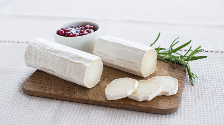 Goat cheese on wooden board 