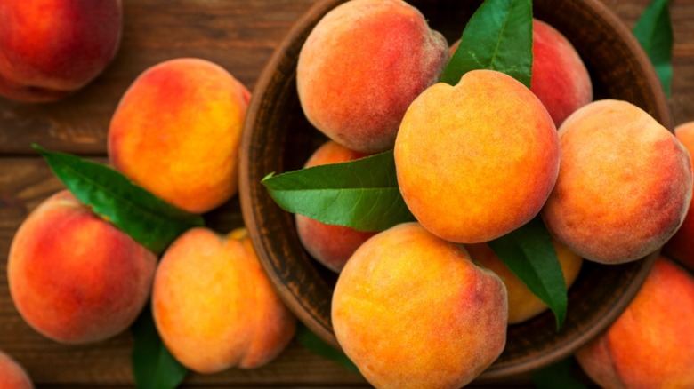 peaches in wooden basket