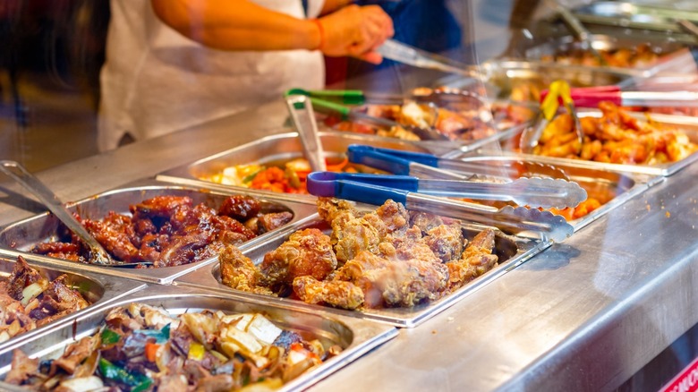 assorted buffet trays with hot food