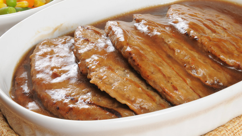 Salisbury steaks in white dish