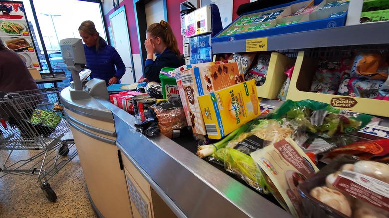 Aldi checkout conveyer belt loaded with food