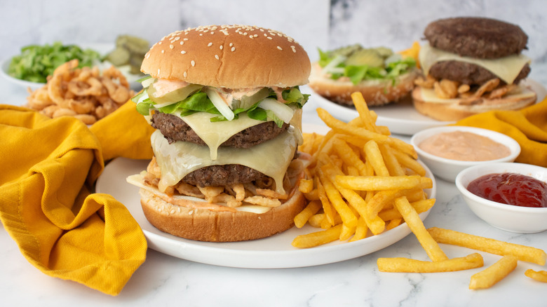 Homemade McDonald's Big Arch burger with fries on plate