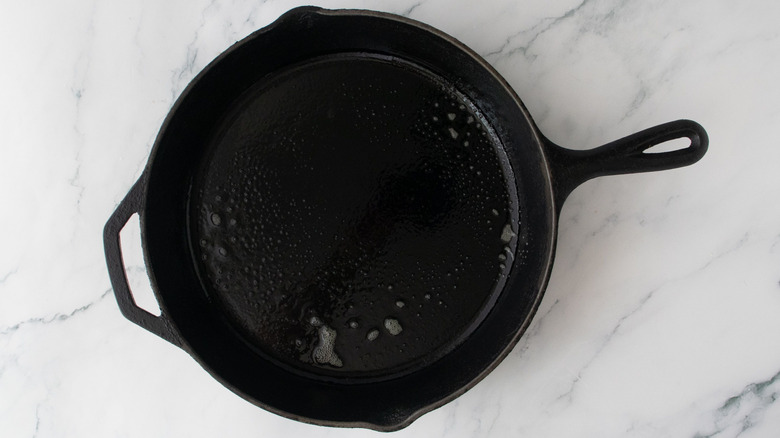 Cast iron skillet spritzed with oil