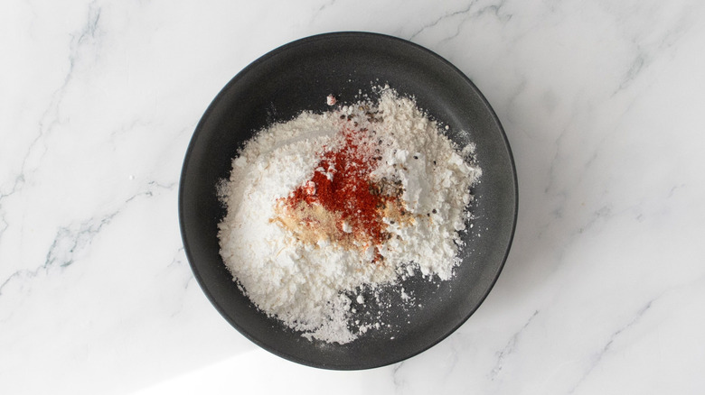 Flour mixture with seasonings in bowl