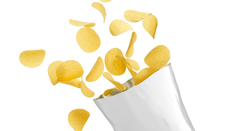 potato chips flying out of open bag