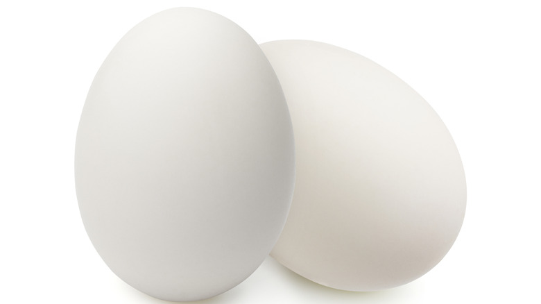 Two eggs on a white background