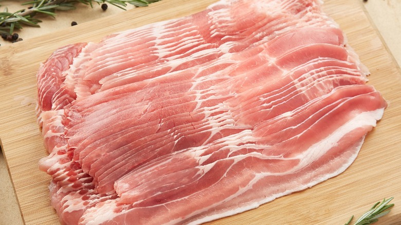 bacon slices on a cutting board