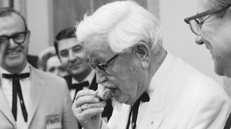 KFC's Colonel Sanders eating chicken