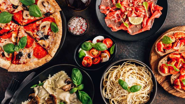 Italian food spread of pizza and pasta