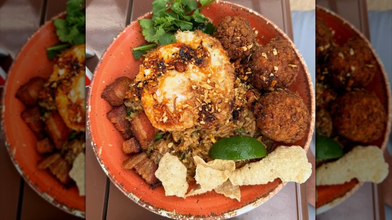 Bowl of Joya's Fried rice with fried chicken meatballs and pork belly