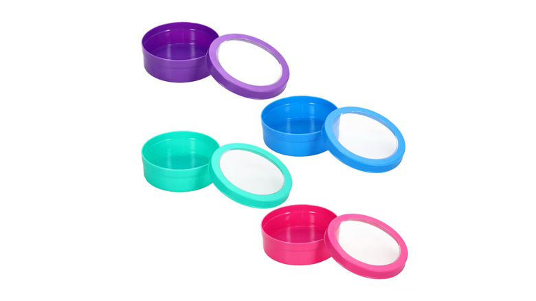 Four multi-colored magnetic plastic containers